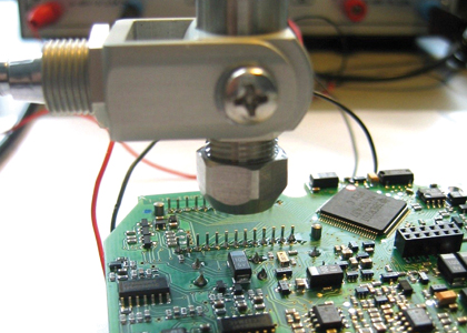 Infrared thermometer during temperature measurement of assembled circuit board